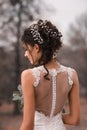 Beautiful bride. Wedding hairstyle and make up. Wonderful pretty bride with wedding bouquet.Closeup portrait of young pretty bride