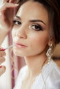 Beautiful bride wedding makeup and hair-style. Stylist makes makeup bride on wedding day. Royalty Free Stock Photo