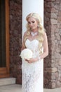 Beautiful Bride wedding Portrait holding bouquet posing in lace Royalty Free Stock Photo