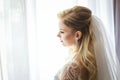 Bride looking out from the window Royalty Free Stock Photo