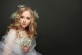Beautiful bride woman with blonde curly hairdo wearing white tulle dress Royalty Free Stock Photo