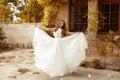 Beautiful bride woman in blowing wedding dress out Royalty Free Stock Photo