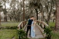 Beautiful Bridesmaid Woman in Blue Dress and Bouquet with Her Date at a Formal Wedding Party Celebration Event Outside in the Wood