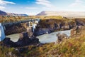 Beautiful bridge in iceland, over a river with mountains