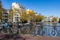 Beautiful Bridge with Bikes over a Canal with Colorful Trees during Autumn in the Centrum District of Amsterdam Royalty Free Stock Photo
