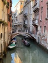 Beautiful bridge over a small canal lined, on colorful building background, Venice, Italy, during Lockdown Crisis COVID-19