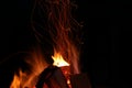 Beautiful bright bonfire with burning wood outdoors at night, space for text Royalty Free Stock Photo
