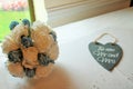 A beautiful bright Bridal Roses Bouquet with slate the new mr and mrs heart. Royalty Free Stock Photo