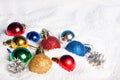 Beautiful, bright Christmas balls in snow.