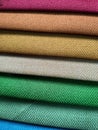 Beautiful bright collection of colorful fabric or textile samples. Fabric texture background