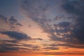 Beautiful bright colorful pink red yellow clouds on dark sky at sunset or sunrise. Evening morning dramatic sky background. Royalty Free Stock Photo