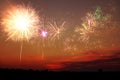 Beautiful bright fireworks lighting up twilight sky outdoors Royalty Free Stock Photo