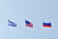 Beautiful and bright flags of the Russian Federation, Israel and the United States of America against the sky. Flags of
