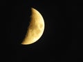 Beautiful bright half moon with surface creators in dark night sky Royalty Free Stock Photo