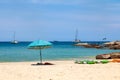 beautiful bright nai harn beach in thailand on phuket island with clear turquoise water in the sea, white sand with umbrella and Royalty Free Stock Photo