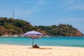 beautiful bright nai harn beach in thailand on phuket island with clear turquoise water in the sea, white sand with umbrella and Royalty Free Stock Photo