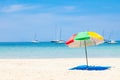 beautiful bright nai harn beach in thailand on phuket island with clear turquoise water in the sea, white sand with umbrella and Royalty Free Stock Photo