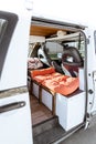 Beautiful bright natural light entering and illuminating an old self converted minivan campervan for van life. The vanlife