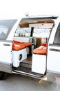 Beautiful bright natural light entering and illuminating an old self converted minivan campervan for van life. The vanlife