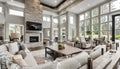 Beautiful and bright open concept living room in new luxury home with view of eating nook and kitchen