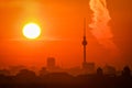 Beautiful bright orange sunset sky over the skyline and TV Tower in Berlin, Germany Royalty Free Stock Photo