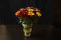 Beautiful bright orange and yellow gerbera flower on the background of other red chrysanthemum flowers , shallow DOF, selective Royalty Free Stock Photo