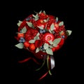 Beautiful bright red edible bouquet of strawberries, pomegranates, apples, blueberries and roses on a black background Royalty Free Stock Photo