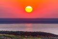 Beautiful bright red sunset over the lake and steppe Royalty Free Stock Photo