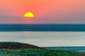 Beautiful bright red sunset over the lake and steppe Royalty Free Stock Photo