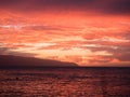 Beautiful bright red sunset over the ocean at the Honululu city in Hawaii islands