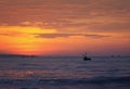 beautiful bright seascape red sunset , blue the sea and the silhouette of the fishing boats Royalty Free Stock Photo