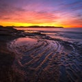 Beautiful bright sunrise over Kiddies Corner on Umina Beach on NSW Central Coast in Australia Royalty Free Stock Photo