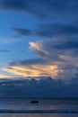 Beautiful bright sunset with colored clouds in the sky over the sea, ocean. Silhouette boat in the sea, lush clouds. Summer Royalty Free Stock Photo