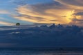 Beautiful bright sunset with colored clouds in the sky over the sea, ocean. Silhouette boat in the sea, lush clouds. Summer Royalty Free Stock Photo