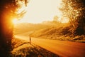 Beautiful sunset over small countryside road Royalty Free Stock Photo