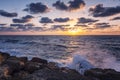 Beautiful bright sunset on the sea, rocky shore Royalty Free Stock Photo