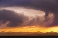 Beautiful bright sunset sky over the mountains silhouette . Dramatic orange clouds after sunset. Nature backgrounds. Royalty Free Stock Photo