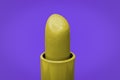Beautiful bright yellow lipstick and purple complementary color on the background