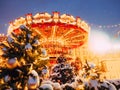 Beautiful brightly glowing carousel on the Red Square decorated and arranged for Christmas and New Year. Christmas fairy Royalty Free Stock Photo