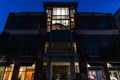 Beautiful brightly lit building on a Charleston street at dusk on a Friday night