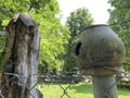 beautiful broken jug on the fence