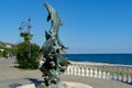 Beautiful bronze fountain with dolphins on Black sea coast with promenade in Aivazovsky landscape park Park Paradise