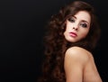 Beautiful brown curly hair woman looking. Closeup on black background Royalty Free Stock Photo