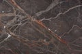 Beautiful brown marble with pink and red veins, called Caravaggio Royalty Free Stock Photo