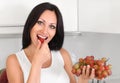 Woman eating grapes Royalty Free Stock Photo