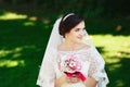 Beautiful brunette bride with bouquet outdoor. Happy bride outdo Royalty Free Stock Photo