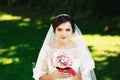 Beautiful brunette bride with bouquet outdoor. Happy bride outdo Royalty Free Stock Photo