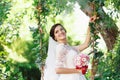 Beautiful brunette bride with bouquet outdoor. Happy bride outdo Royalty Free Stock Photo