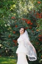 Beautiful brunette bride with bouquet outdoor. Happy bride outdo Royalty Free Stock Photo