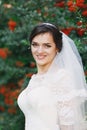 Beautiful brunette bride with bouquet outdoor. Happy bride outdo Royalty Free Stock Photo